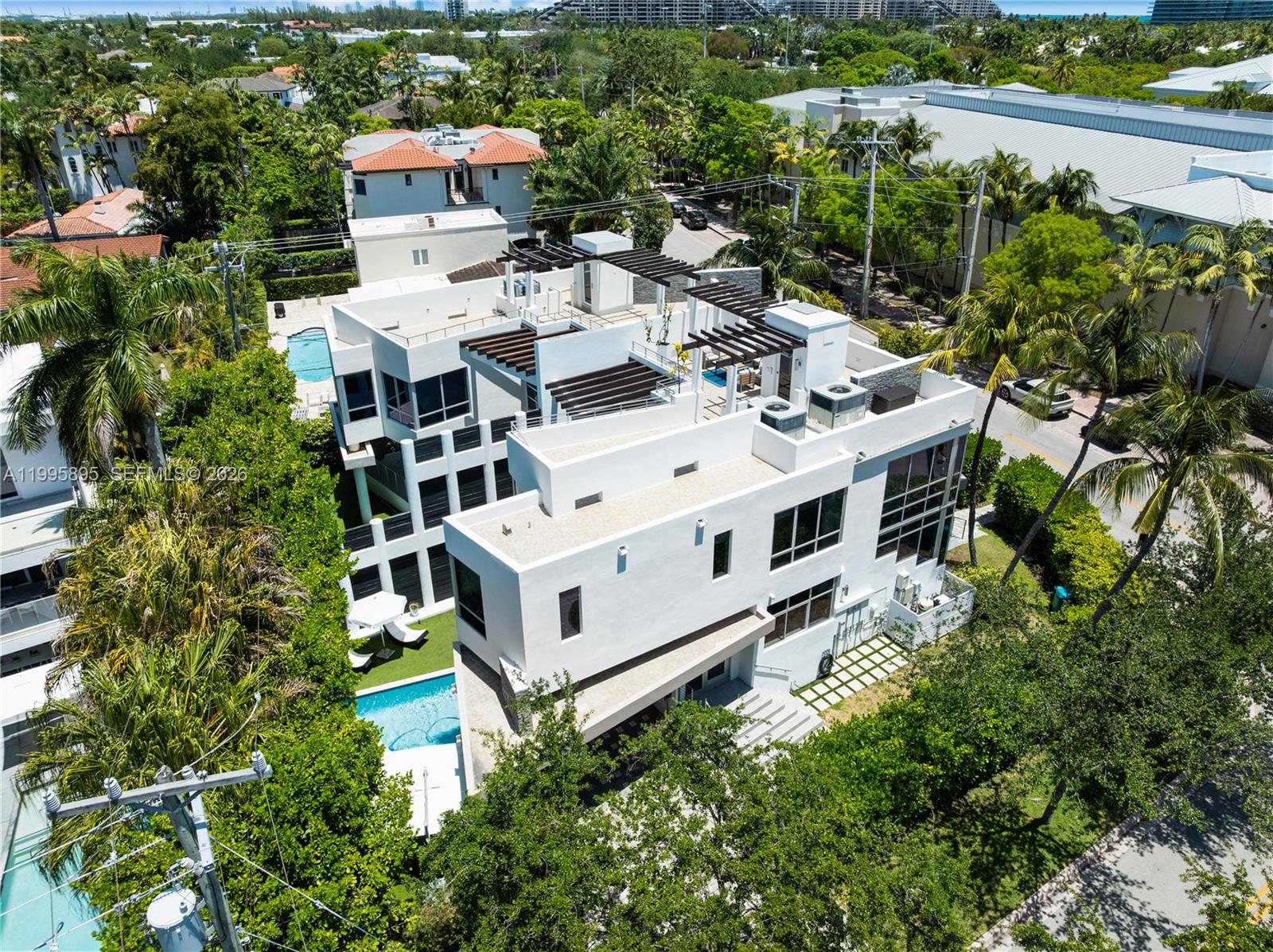 548 Fernwood Road, Unit 548 Key Biscayne, FL 33149 - Photo 46 of 50 an aerial view of a house with balcony and trees al around