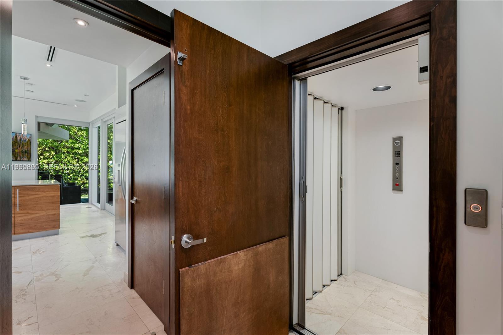 548 Fernwood Road, Unit 548 Key Biscayne, FL 33149 - Photo 10 of 50 a view of elevator with hallway