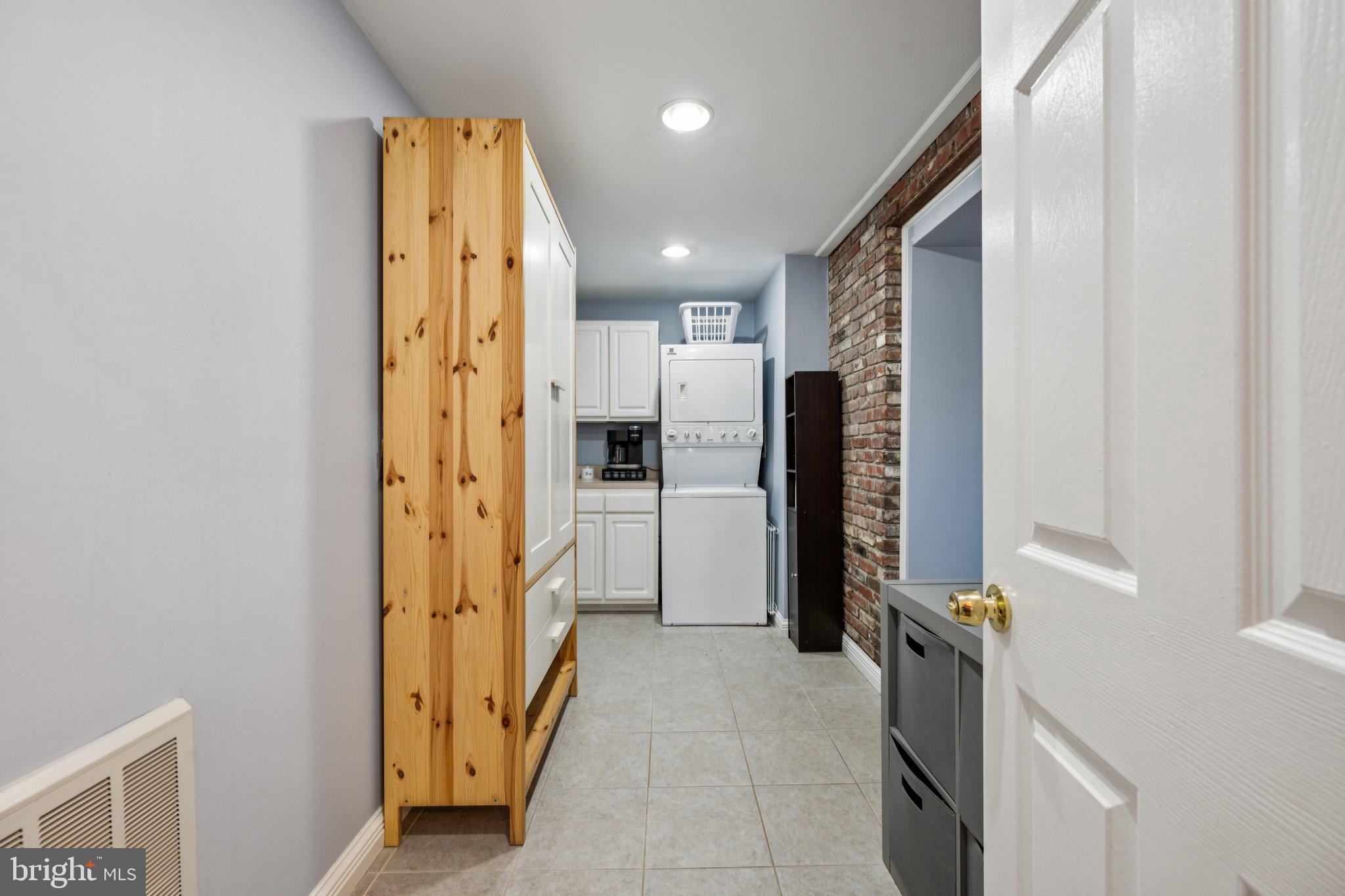 2731 Hudson Street Baltimore, MD 21224 - Photo 11 of 35 a view of hallway with stairs and a refrigerator