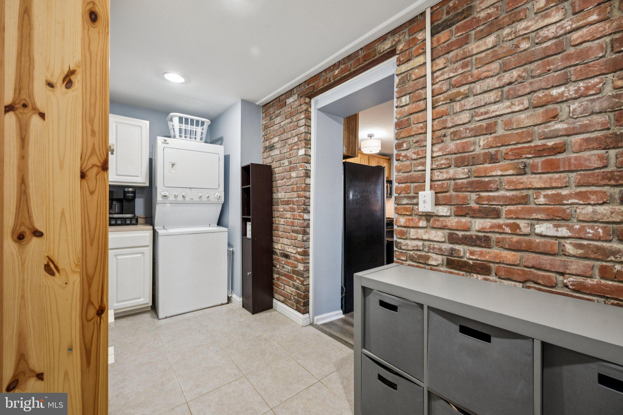 2731 Hudson Street Baltimore, MD 21224 - Photo 14 of 35 a kitchen with a refrigerator and a sink