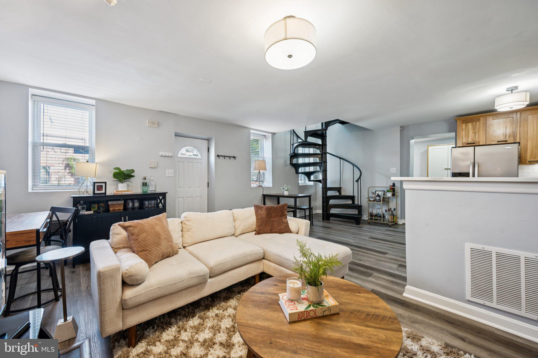 2731 Hudson Street Baltimore, MD 21224 - Photo 2 of 35 a living room with furniture or couch and a dining table