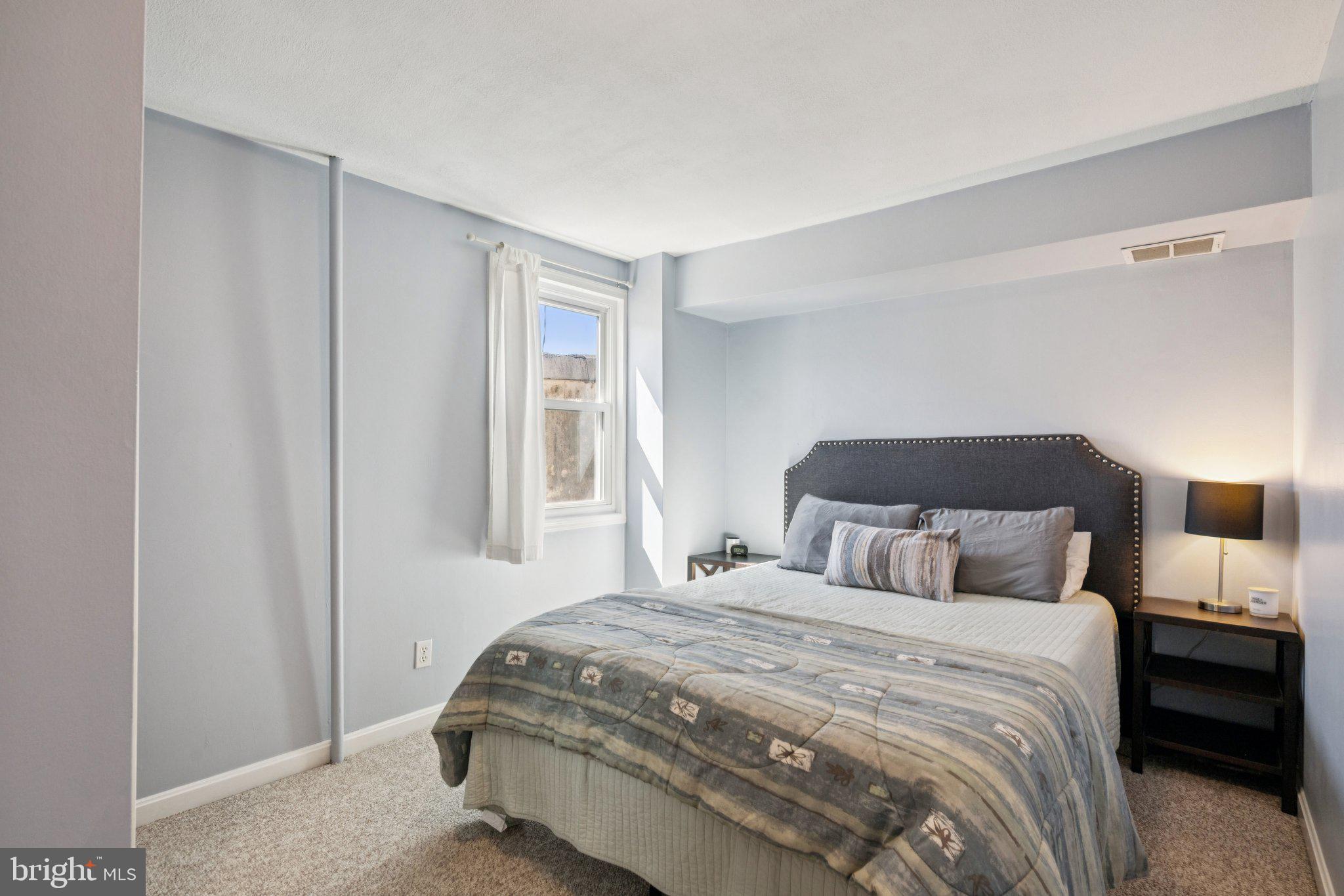 2731 Hudson Street Baltimore, MD 21224 - Photo 21 of 35 a bedroom with a bed and a window