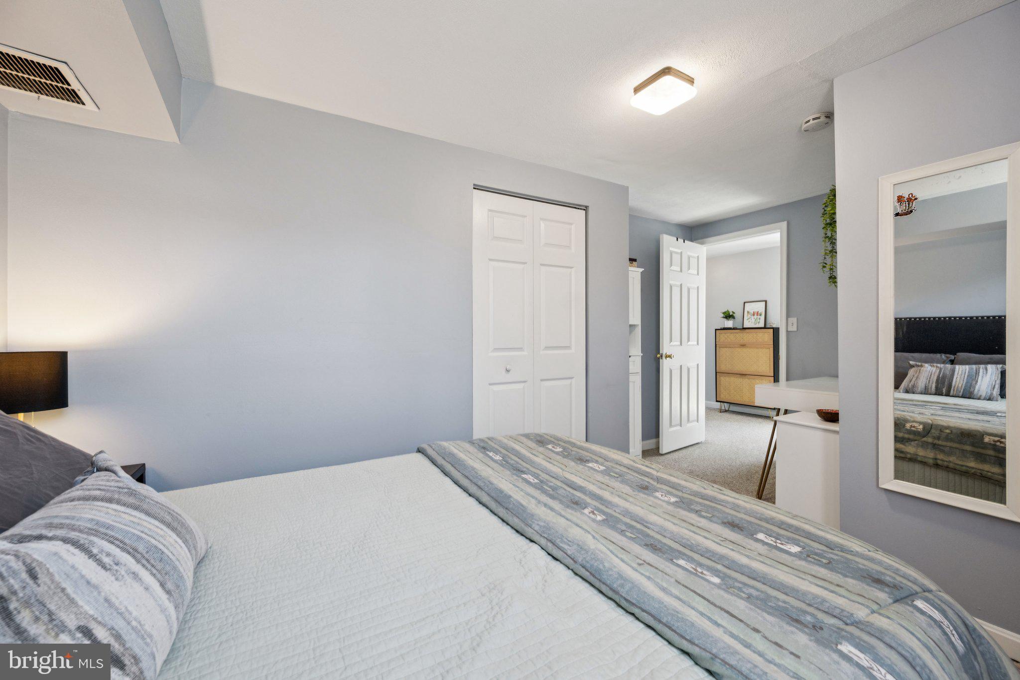 2731 Hudson Street Baltimore, MD 21224 - Photo 23 of 35 a bedroom with a bed and a flat tv screen