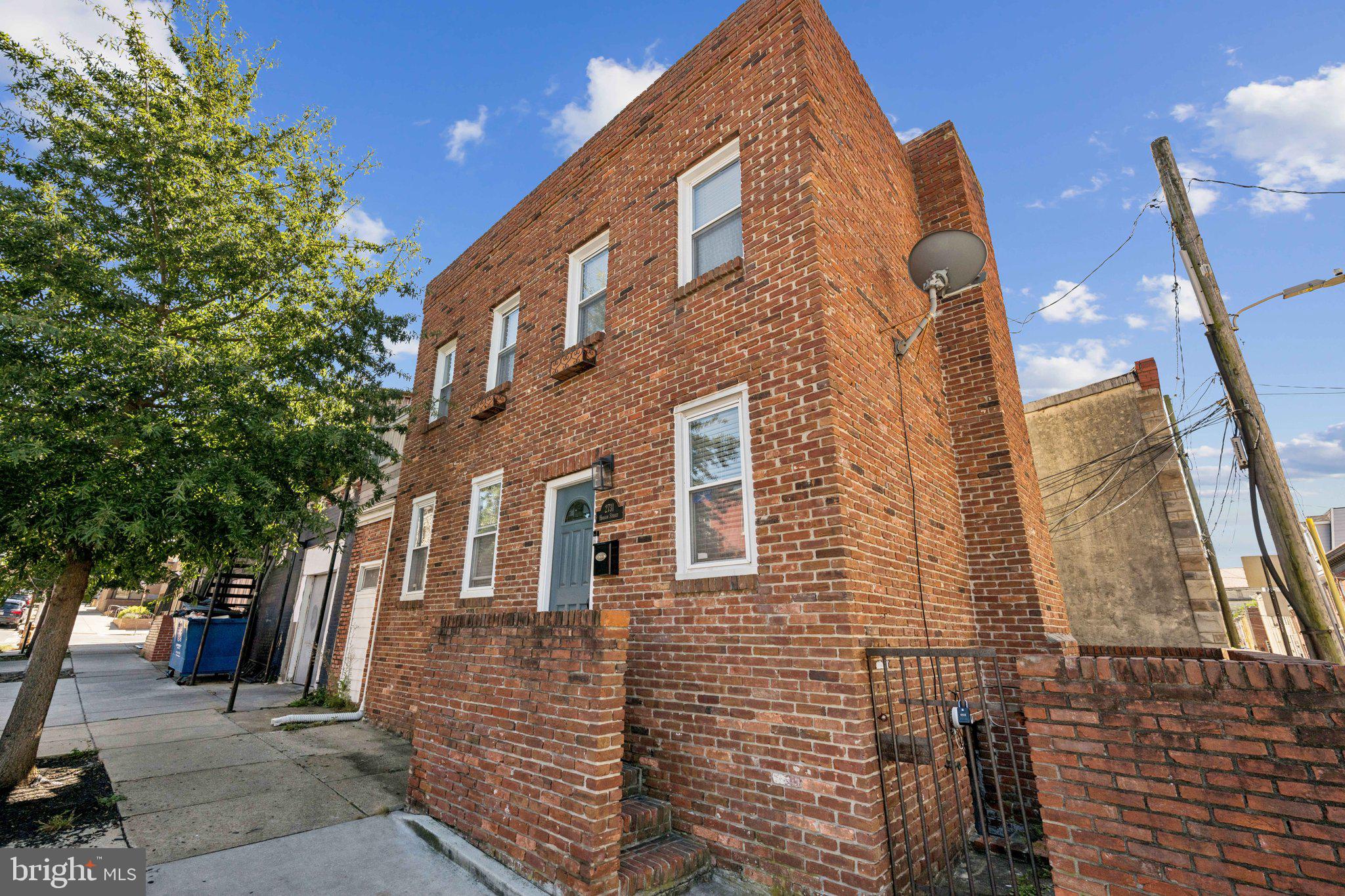 2731 Hudson Street Baltimore, MD 21224 - Photo 34 of 35 a view of a large brick building next to a brick building