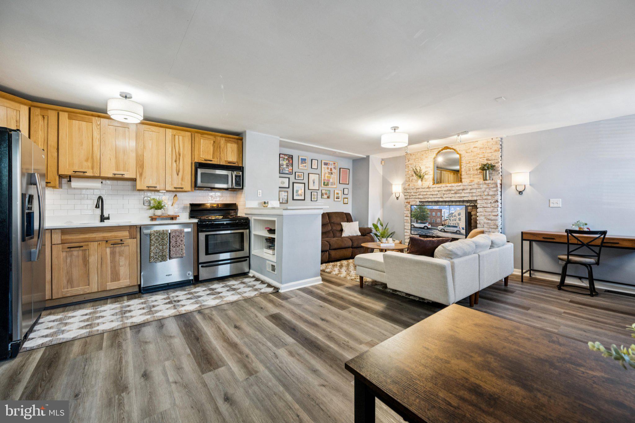 2731 Hudson Street Baltimore, MD 21224 - Photo 9 of 35 a living room with furniture and a fireplace