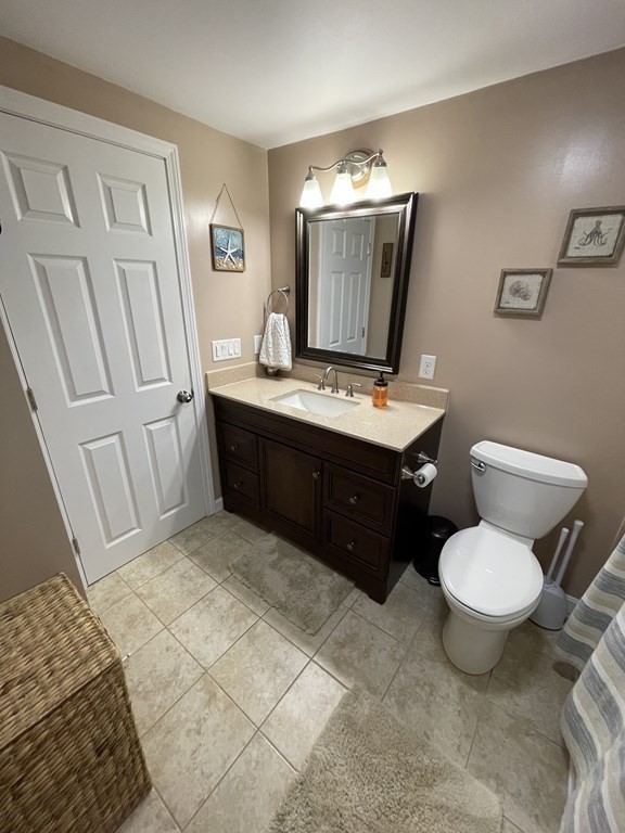 547 Delano Road Marion, MA 02738 - Photo 17 of 28 a bathroom with a toilet sink and mirror