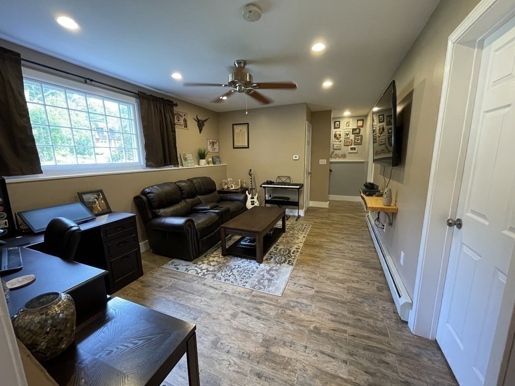547 Delano Road Marion, MA 02738 - Photo 22 of 28 a living room with furniture and a large window