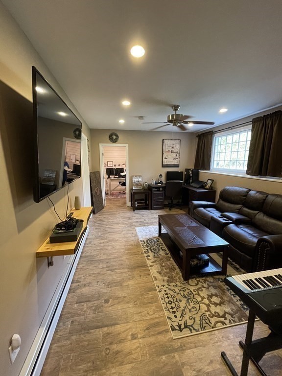 547 Delano Road Marion, MA 02738 - Photo 23 of 28 a living room with furniture and a flat screen tv