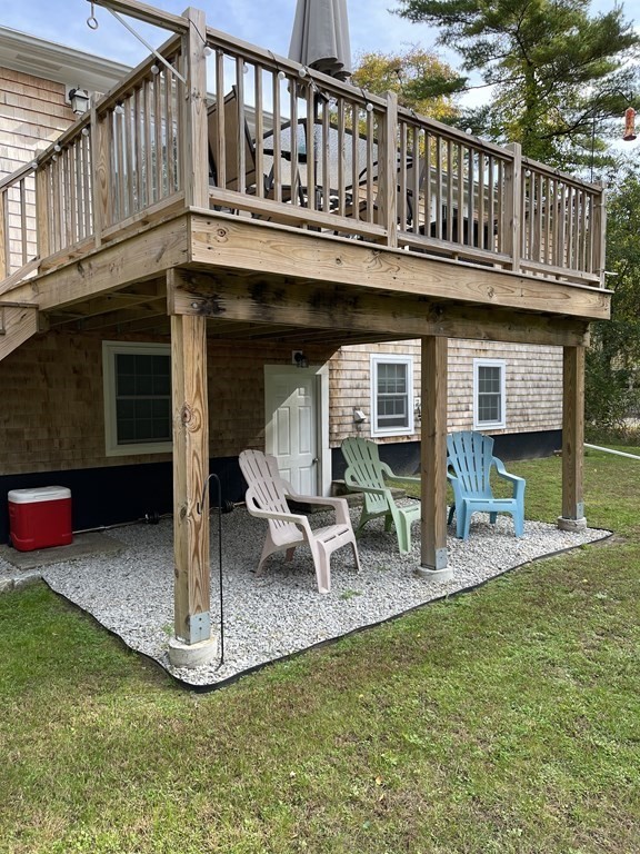547 Delano Road Marion, MA 02738 - Photo 8 of 28 a view of a house with a yard porch and furniture