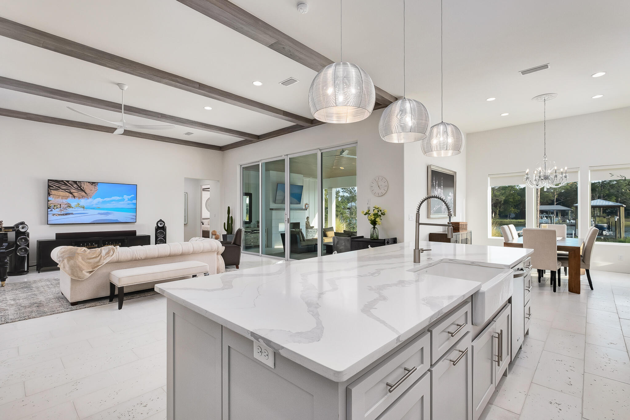 336 East Shipwreck Road Santa Rosa Beach, FL 32459 - Photo 13 of 50 an open kitchen with granite countertop a table and chairs