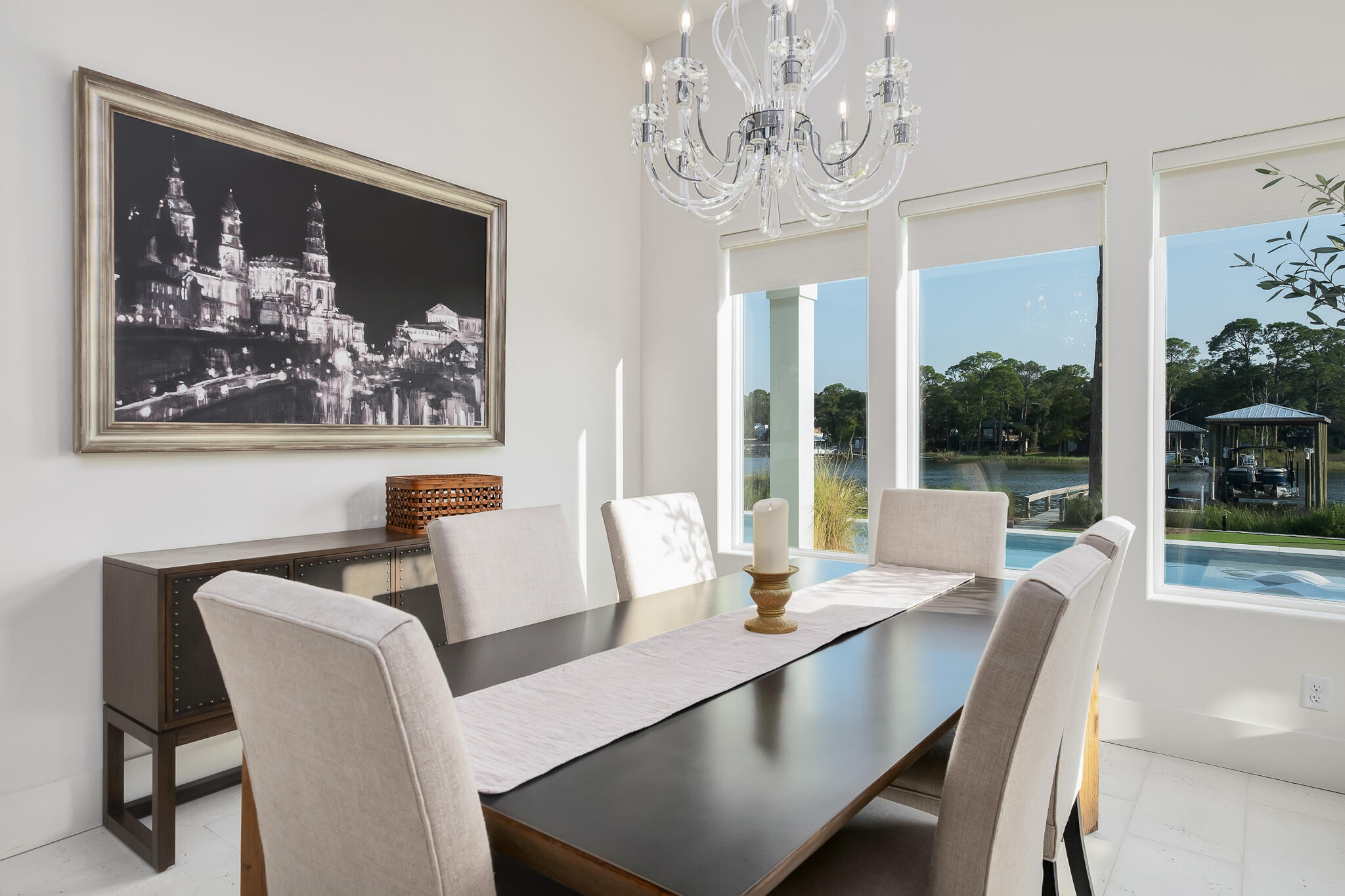 336 East Shipwreck Road Santa Rosa Beach, FL 32459 - Photo 14 of 50 a view of a dining room with furniture large windows and wooden floor
