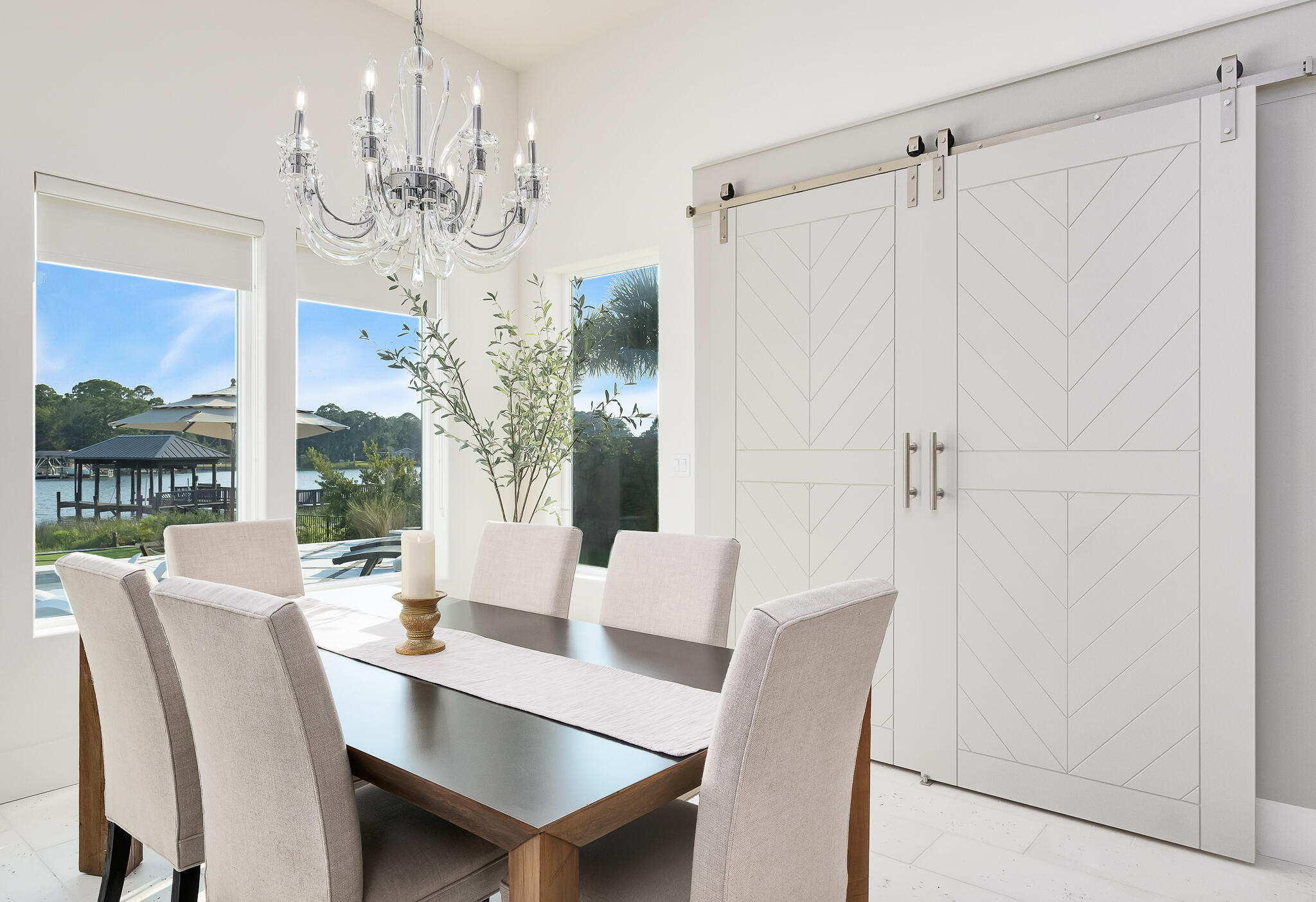 336 East Shipwreck Road Santa Rosa Beach, FL 32459 - Photo 15 of 50 a view of a dining room with furniture a chandelier and large window