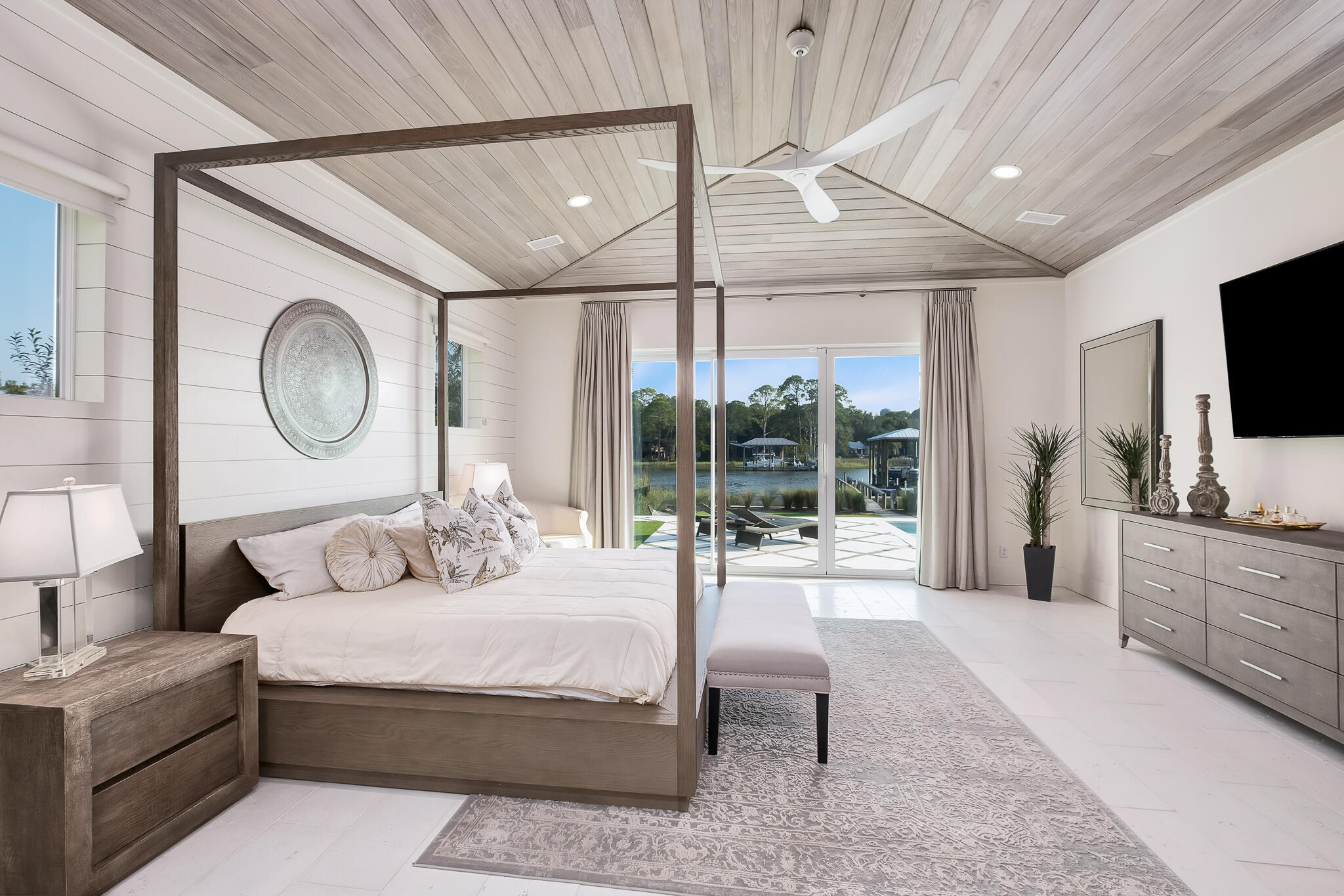 336 East Shipwreck Road Santa Rosa Beach, FL 32459 - Photo 18 of 50 a bedroom with a large bed and a flat tv screen on dresser