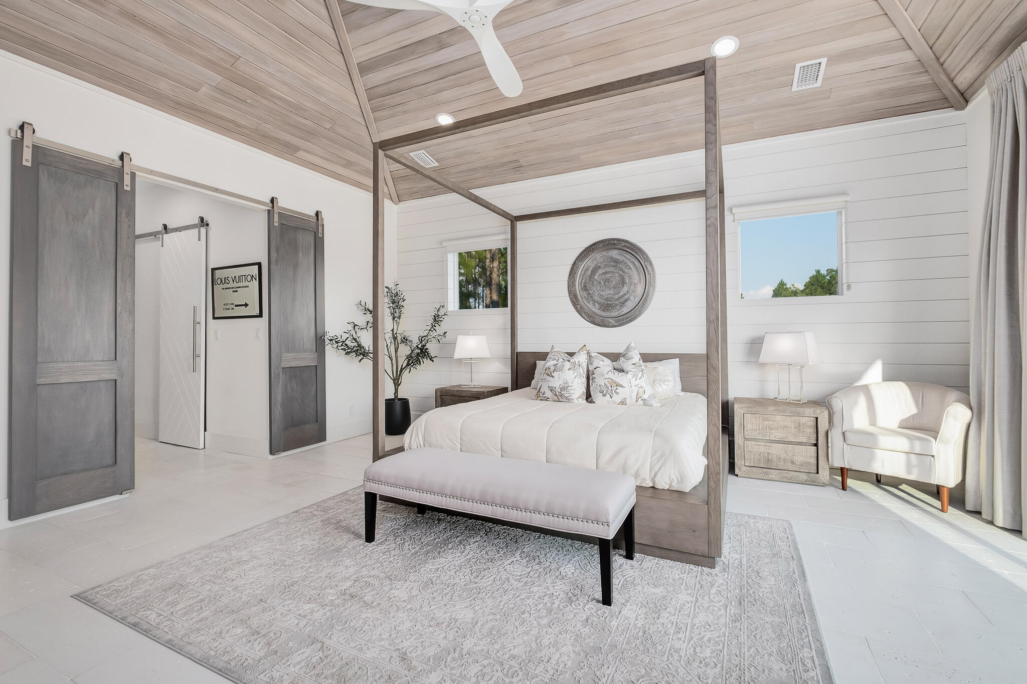 336 East Shipwreck Road Santa Rosa Beach, FL 32459 - Photo 19 of 50 a bedroom with a bed a mirror and paintings on the wall