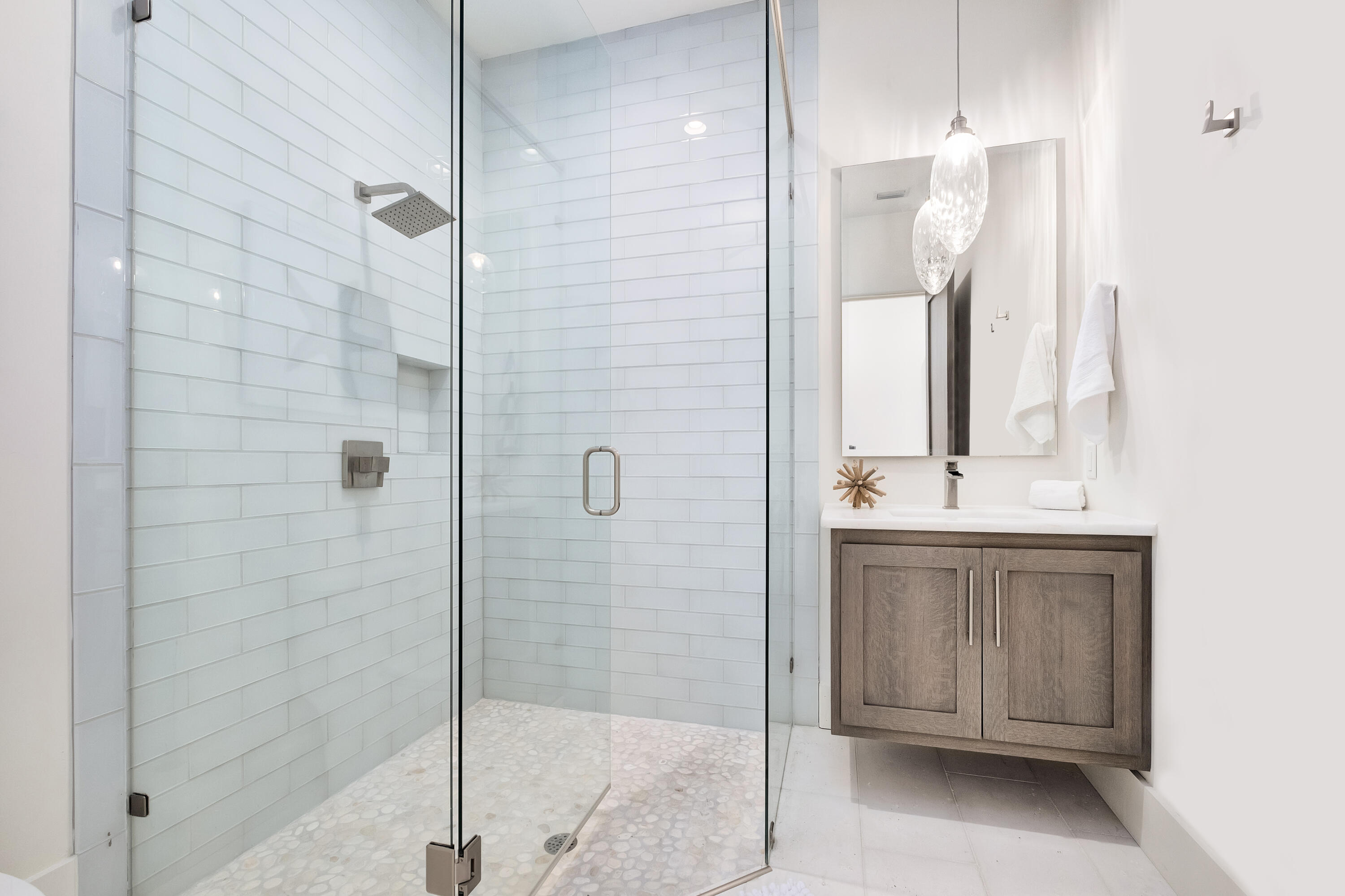 336 East Shipwreck Road Santa Rosa Beach, FL 32459 - Photo 25 of 50 a bathroom with a shower sink and mirror