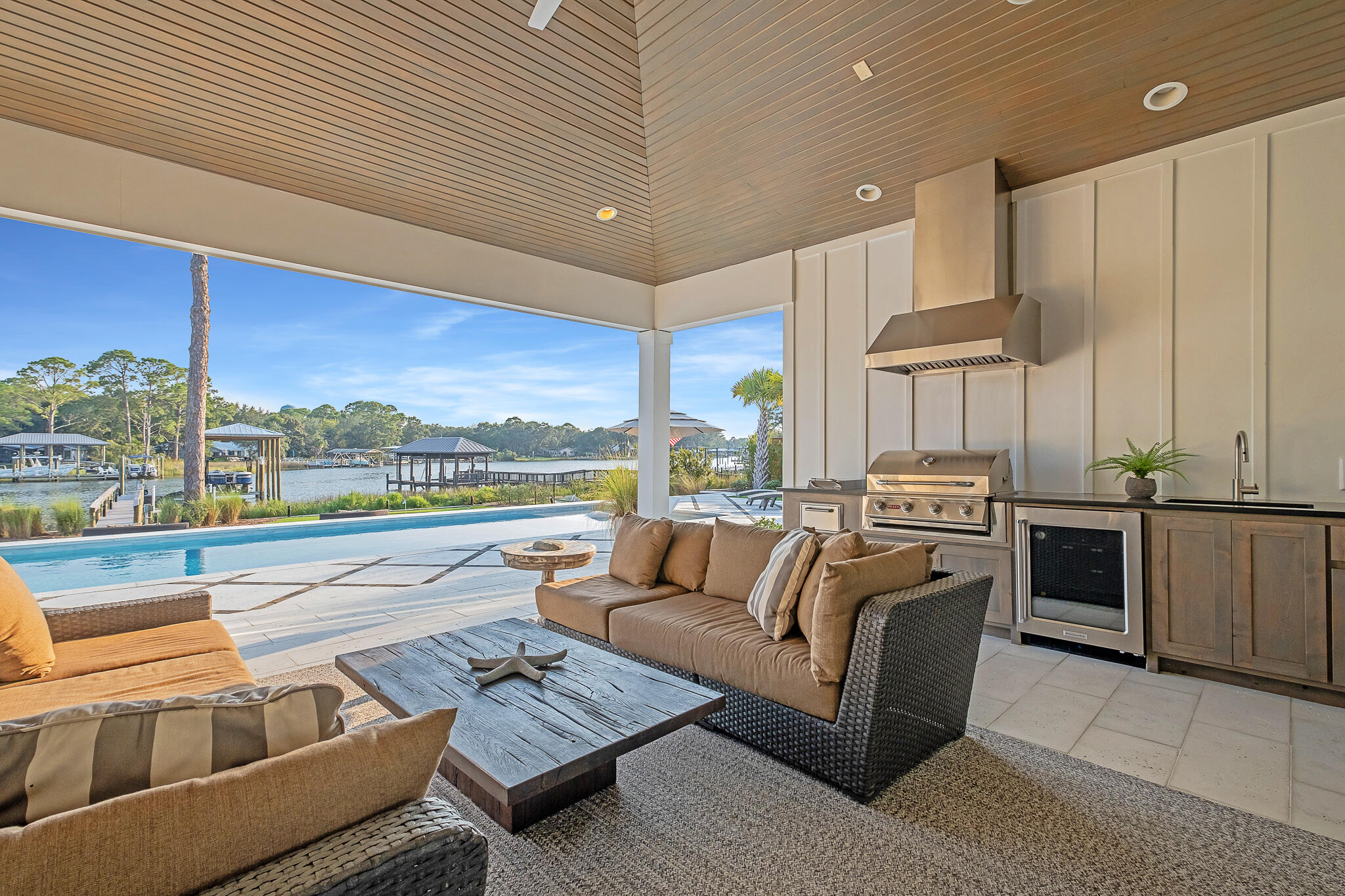336 East Shipwreck Road Santa Rosa Beach, FL 32459 - Photo 31 of 50 a living room with stainless steel appliances kitchen island granite countertop a couch