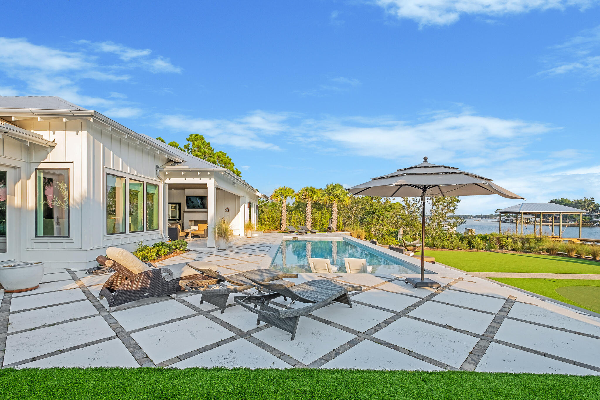 336 East Shipwreck Road Santa Rosa Beach, FL 32459 - Photo 32 of 50 a view of pool with lawn chairs and large trees
