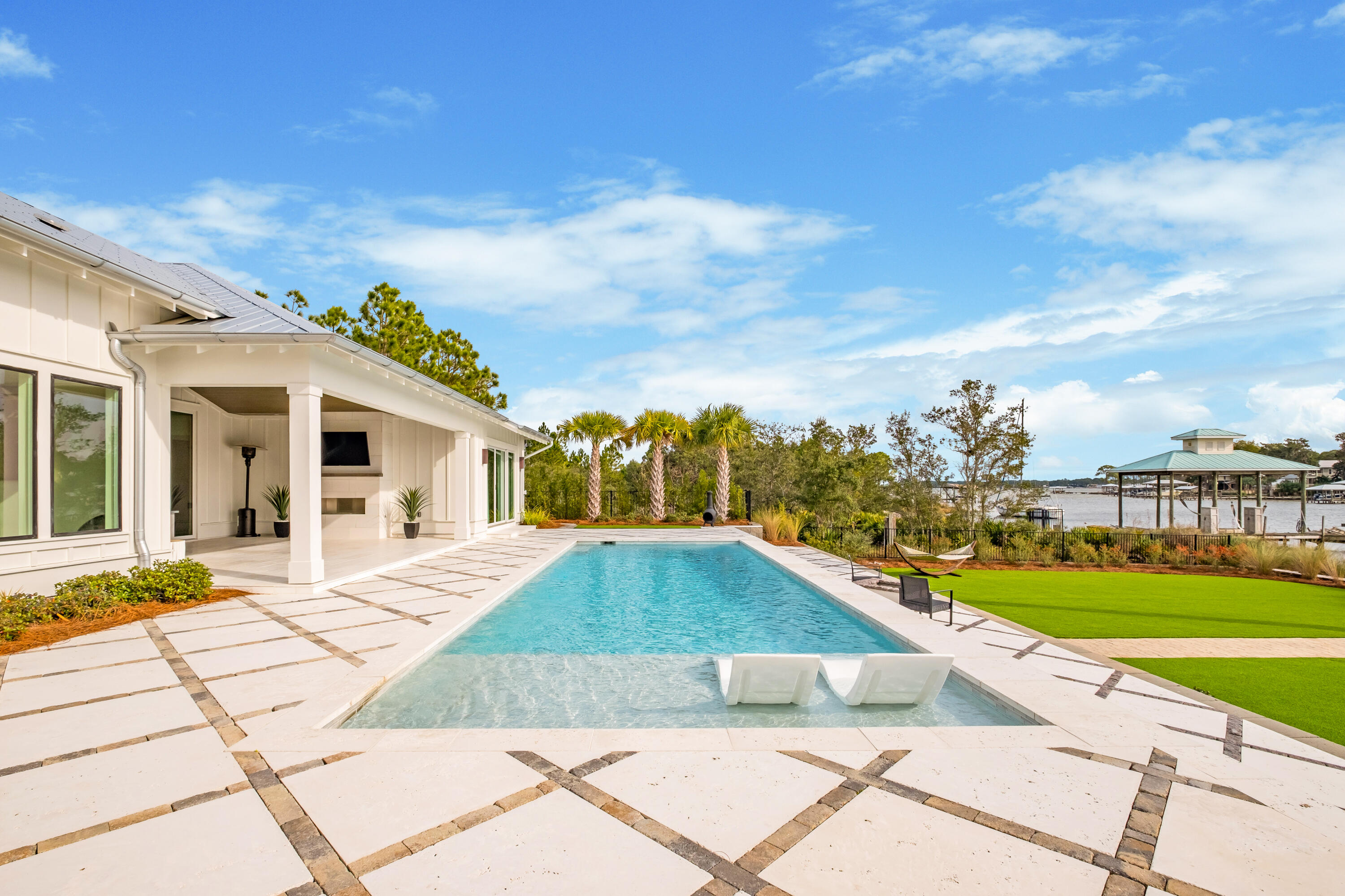 336 East Shipwreck Road Santa Rosa Beach, FL 32459 - Photo 35 of 50 a view of a white house with a yard