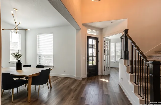 a view of a dining room with furniture window and wooden floor