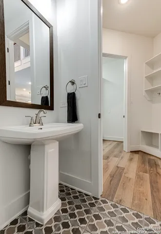 a bathroom with a sink and a mirror