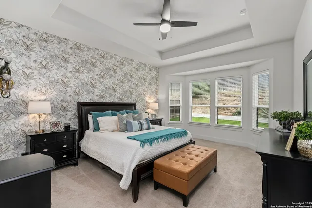 a bedroom with a bed and a couch