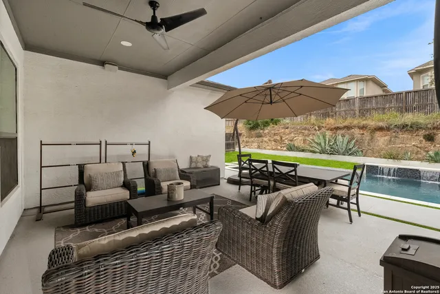 a living room with furniture and a patio