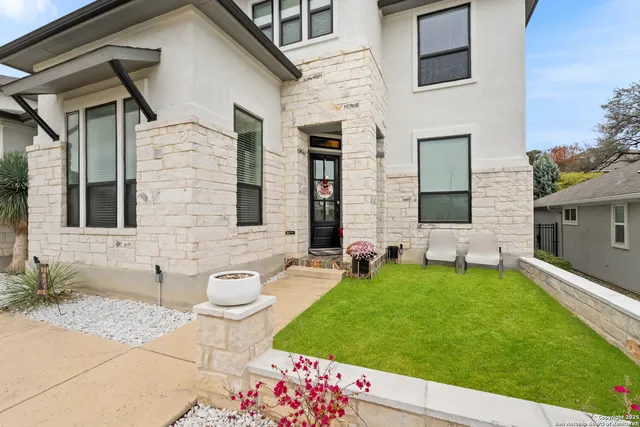 a front view of a house with garden