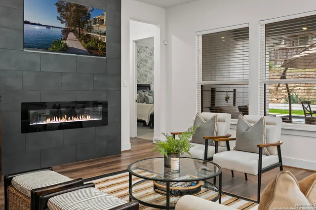 a living room with furniture and a fireplace