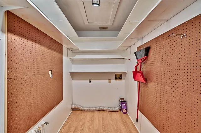 a view of a room with wooden floor and iron walls