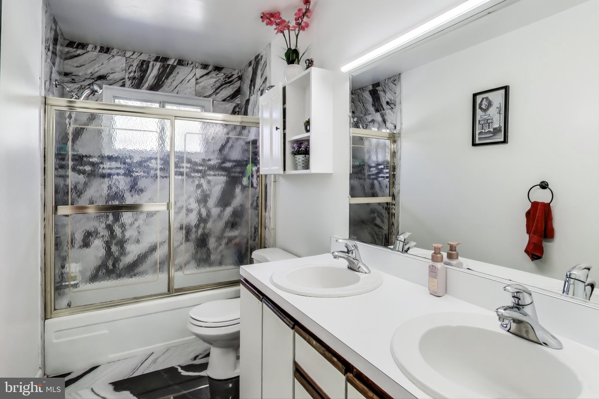 1804 Ironton Drive Oxon Hill, MD 20745 - Photo 14 of 37 a bathroom with a sink toilet and shower