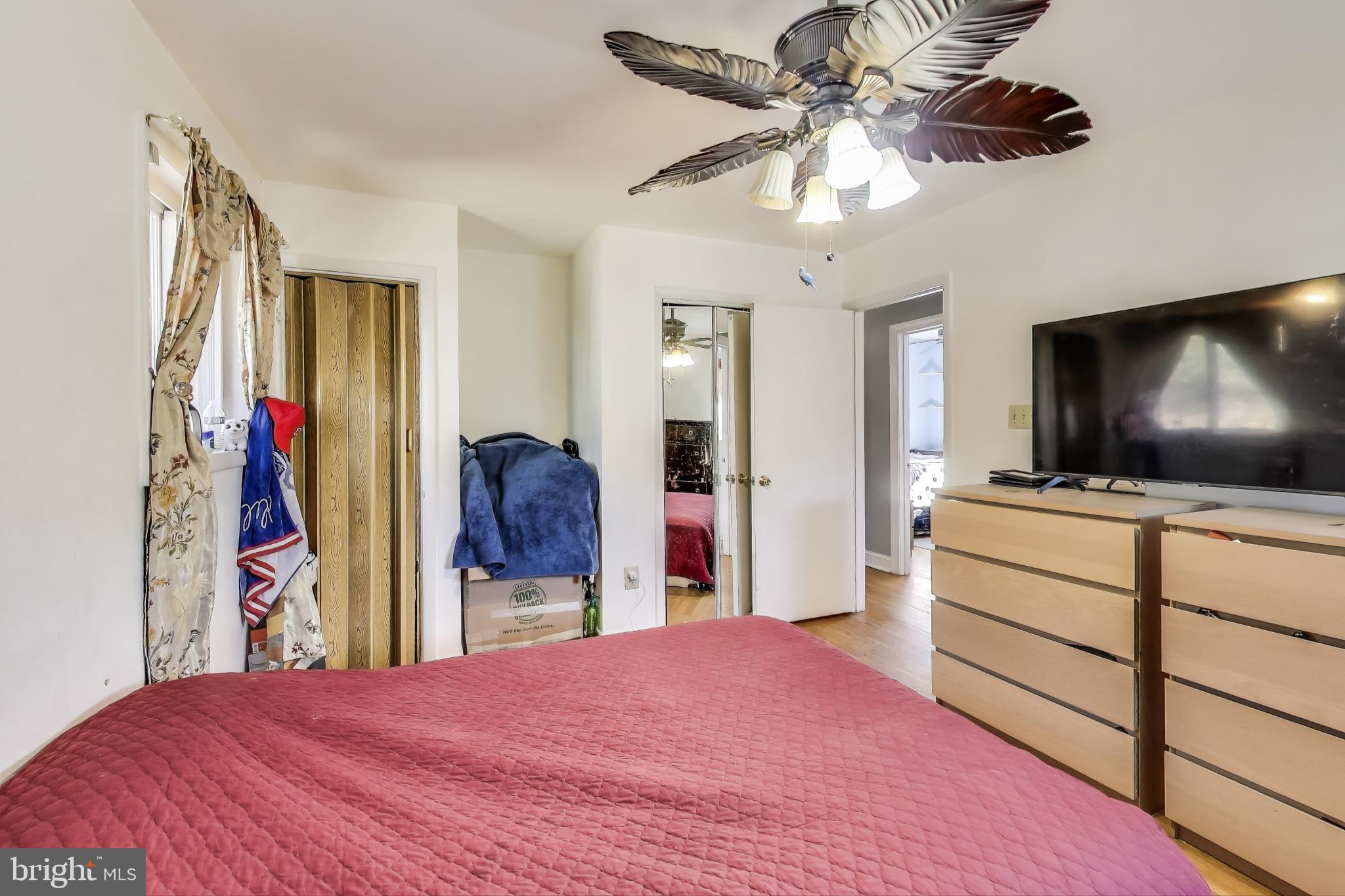 1804 Ironton Drive Oxon Hill, MD 20745 - Photo 17 of 37 a bedroom with a bed and a flat screen tv