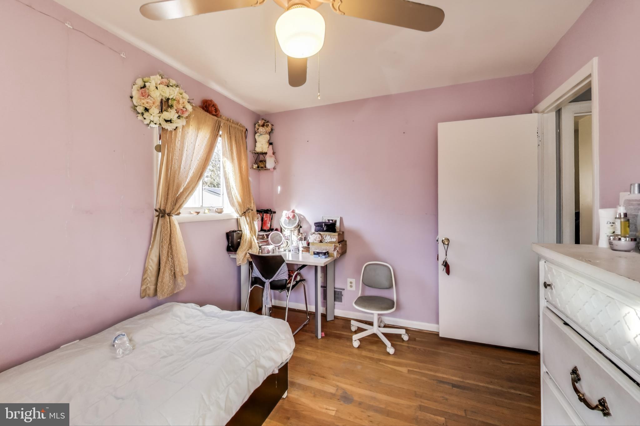 1804 Ironton Drive Oxon Hill, MD 20745 - Photo 19 of 37 a bedroom with a bed and a chandelier