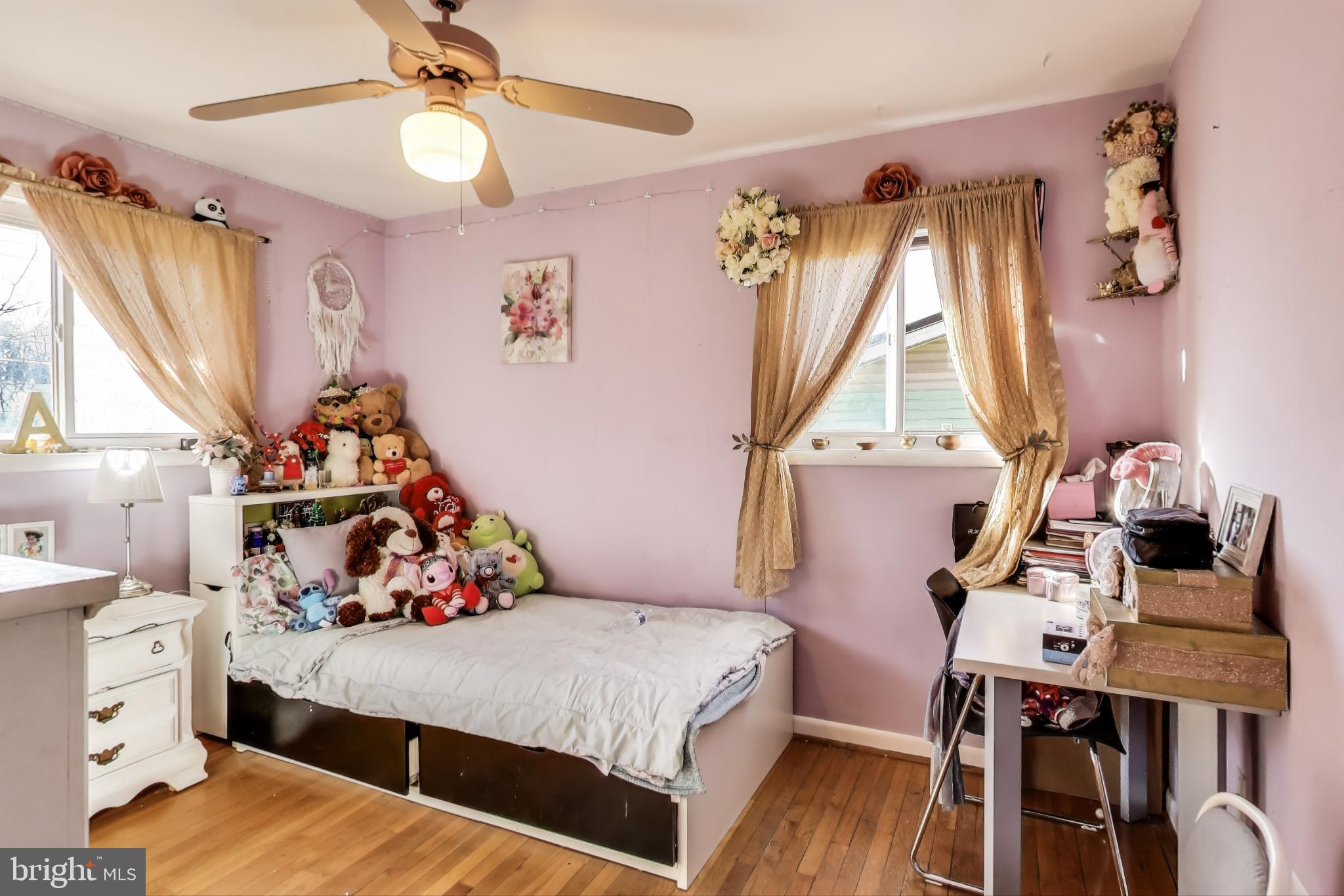 1804 Ironton Drive Oxon Hill, MD 20745 - Photo 20 of 37 a bedroom with a bed and a chandelier