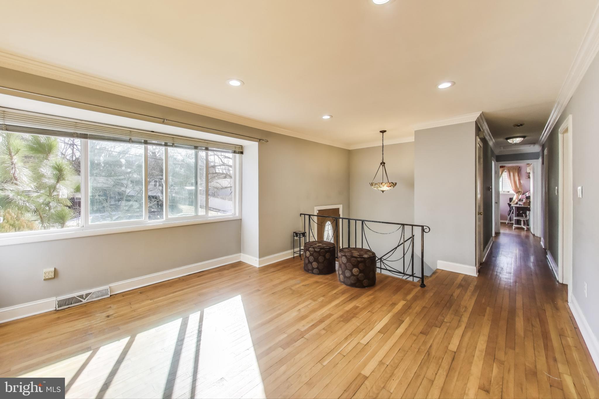 1804 Ironton Drive Oxon Hill, MD 20745 - Photo 24 of 37 a view of a living room and a kitchen with wooden floor