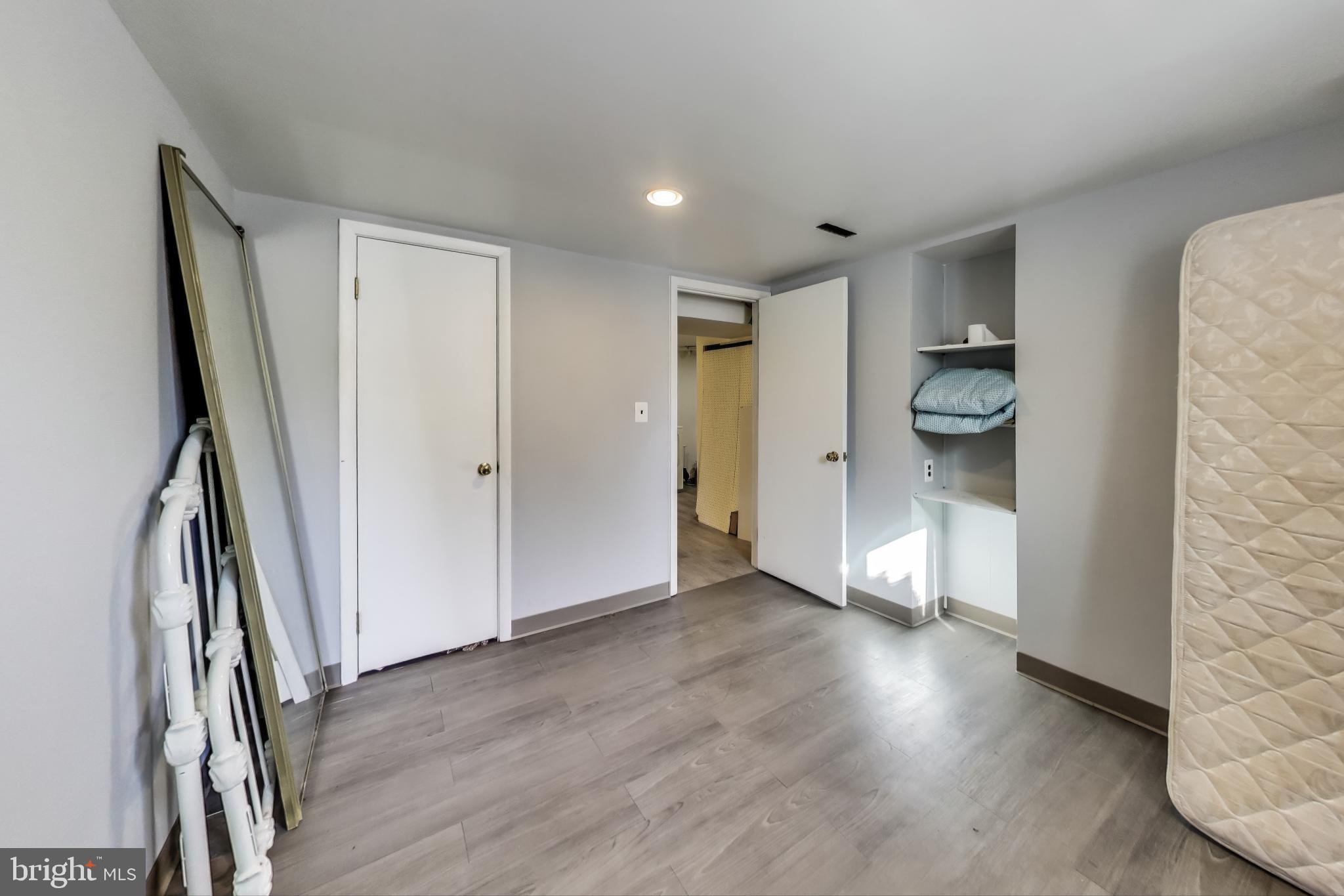 1804 Ironton Drive Oxon Hill, MD 20745 - Photo 27 of 37 a view of a hallway with wooden floor and staircase