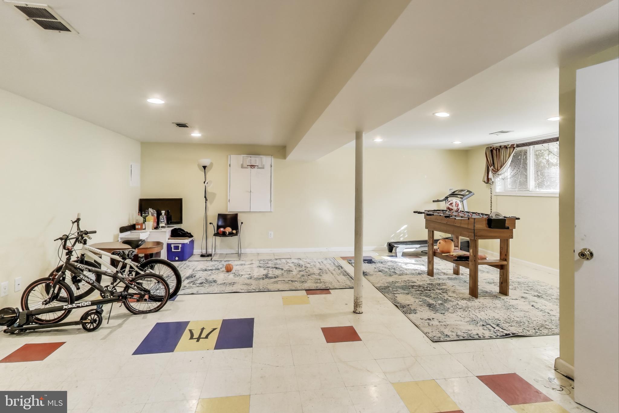 1804 Ironton Drive Oxon Hill, MD 20745 - Photo 29 of 37 a living room with furniture a mirror and a piano