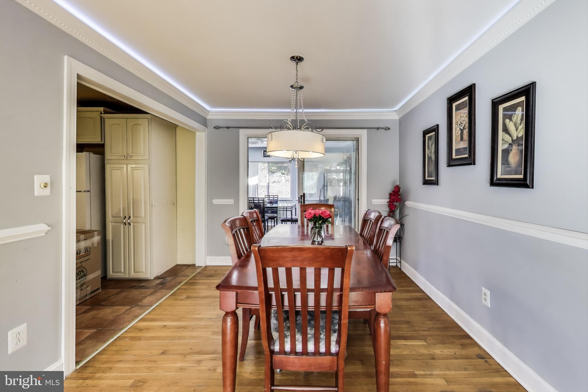 1804 Ironton Drive Oxon Hill, MD 20745 - Photo 7 of 37 a view of a dining room with furniture window and wooden floor