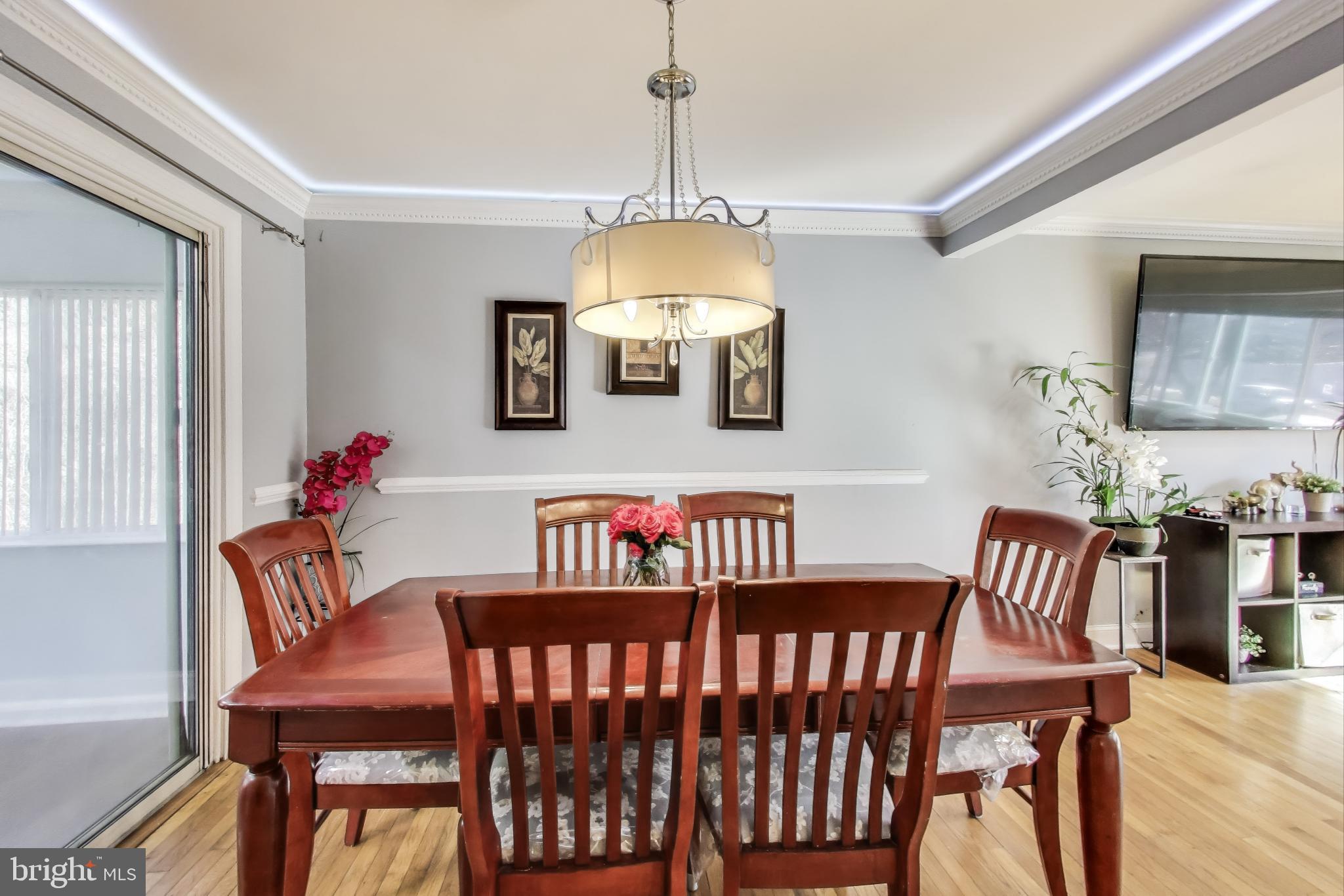 1804 Ironton Drive Oxon Hill, MD 20745 - Photo 9 of 37 a view of a dining room with furniture window and wooden floor