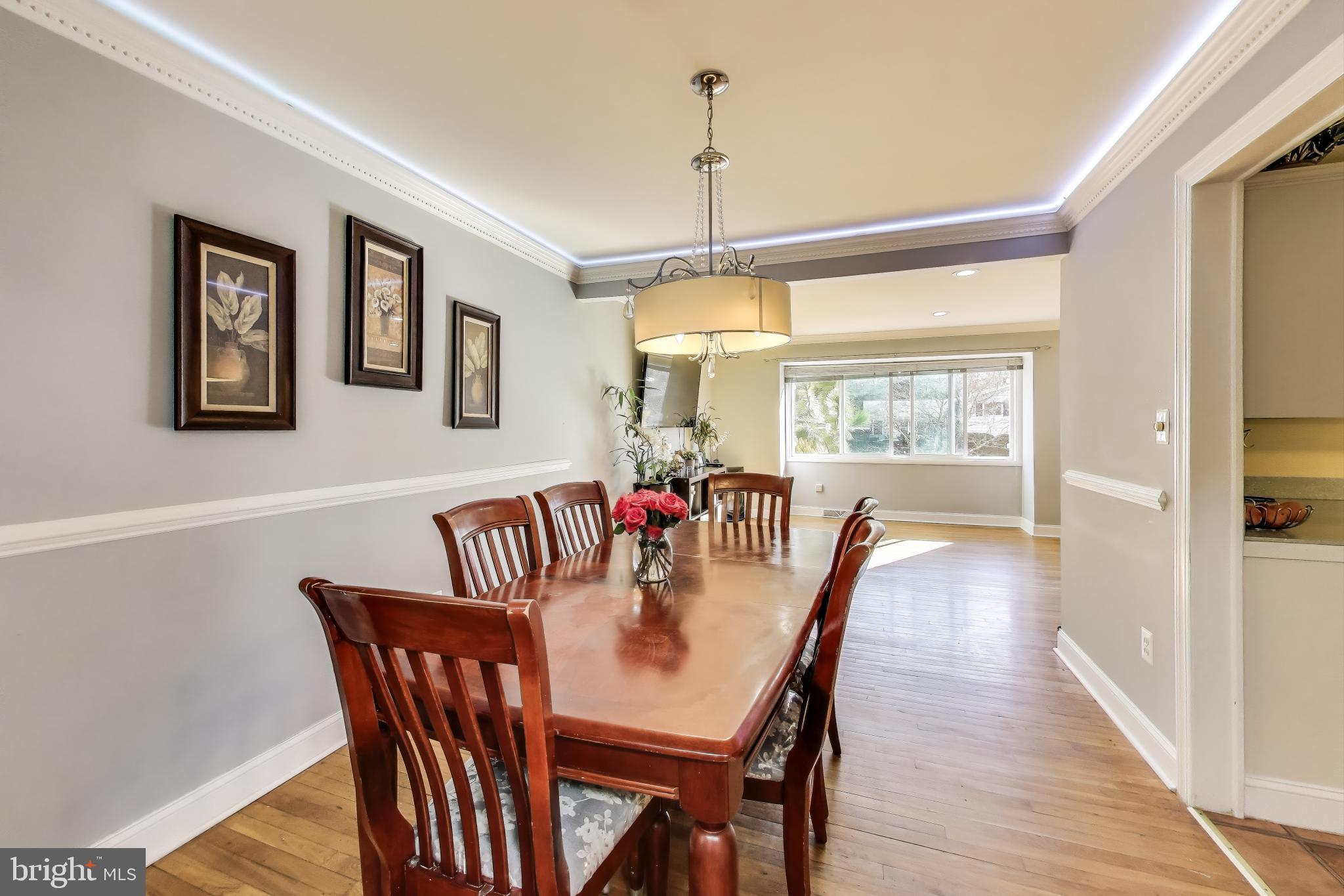 1804 Ironton Drive Oxon Hill, MD 20745 - Photo 10 of 37 a view of a dining room with furniture window and wooden floor