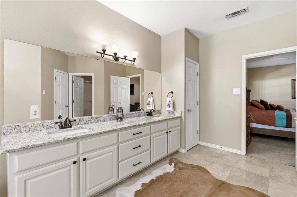 219 Friends Road Denison, TX 75021 - Photo 16 of 40 Primary bathroom - Double sink vanity, granite countertops-new sinks - faucets
