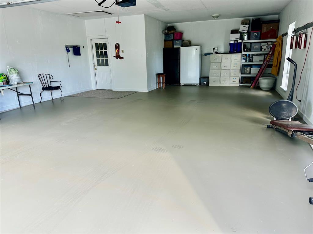 219 Friends Road Denison, TX 75021 - Photo 23 of 40 Oversized garage interior will fit your dually truck