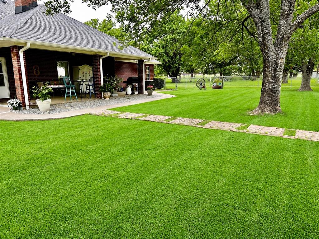 219 Friends Road Denison, TX 75021 - Photo 25 of 40 Rear of house - separate fenced yard for pets