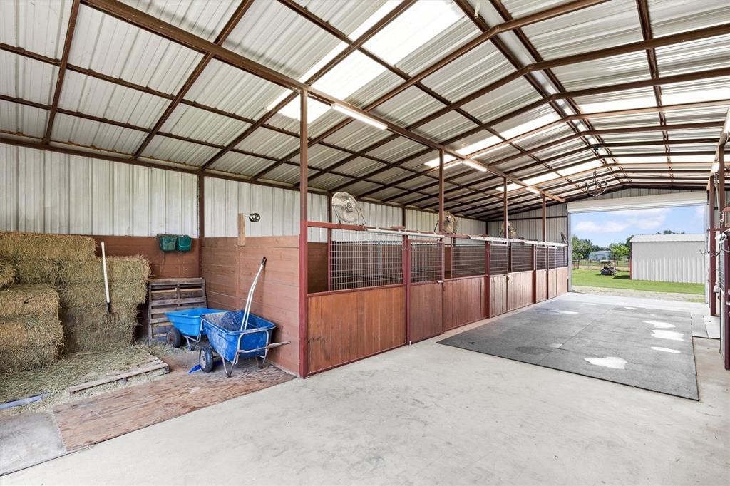 219 Friends Road Denison, TX 75021 - Photo 29 of 40 Stalls and feed area