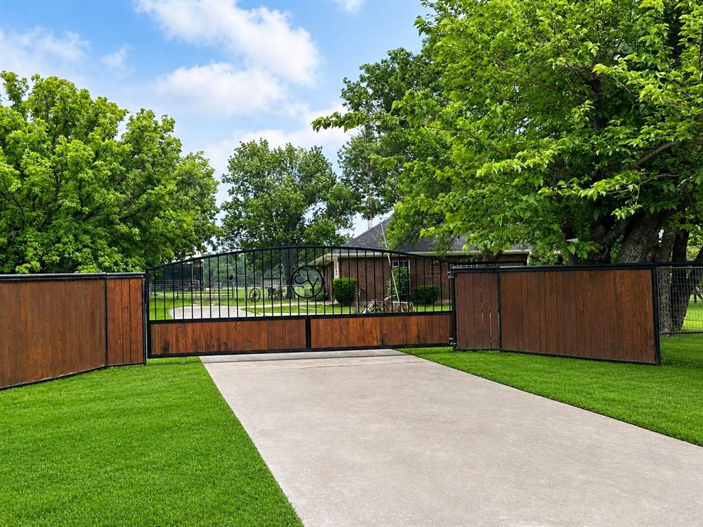 219 Friends Road Denison, TX 75021 - Photo 3 of 40 Gated Entrance