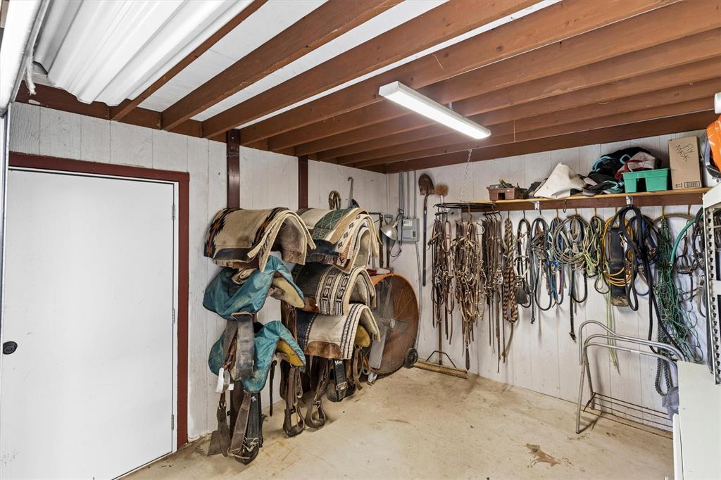219 Friends Road Denison, TX 75021 - Photo 31 of 40 Tack room with large roll up door