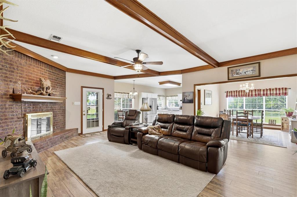 219 Friends Road Denison, TX 75021 - Photo 7 of 40 Living room - wood beam ceilings - fireplace