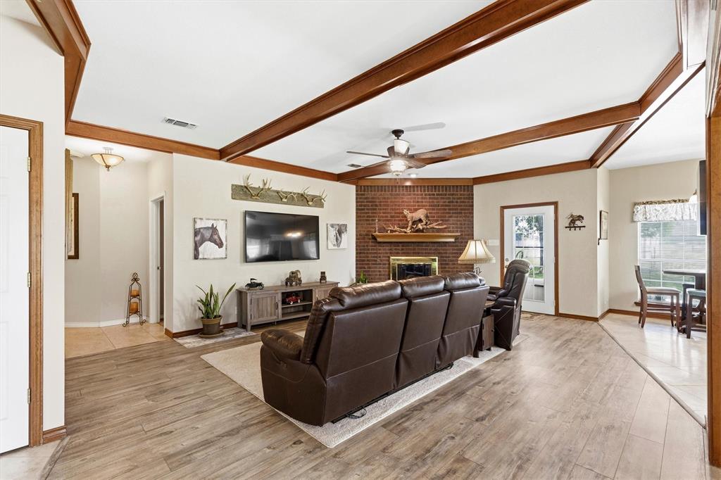 219 Friends Road Denison, TX 75021 - Photo 8 of 40 Living room - wood beam ceilings - fireplace