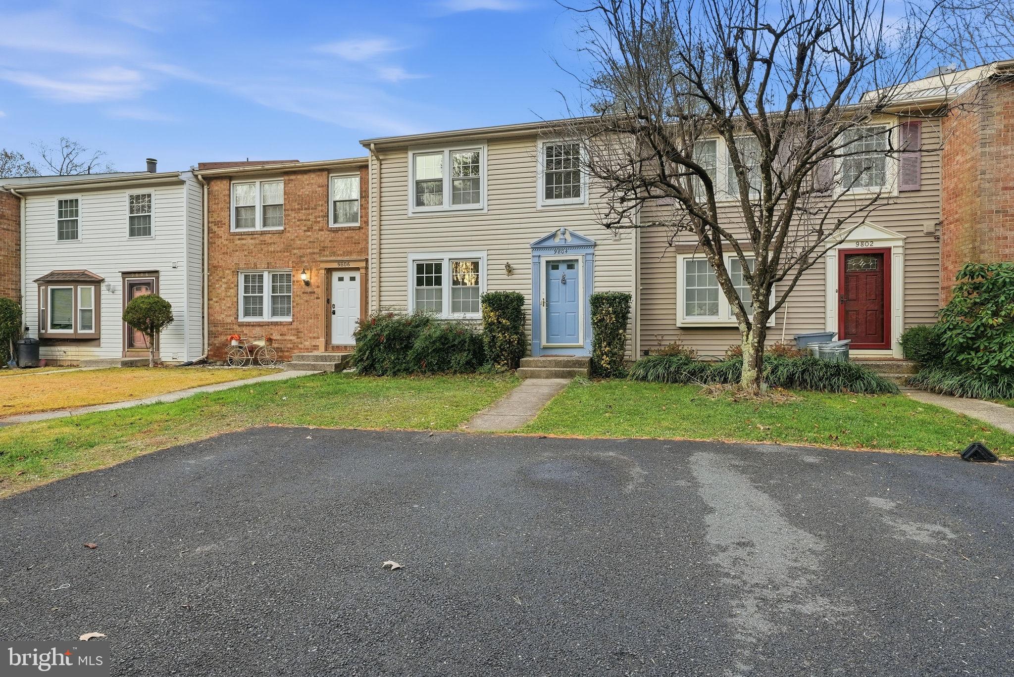 9804 Gabon Court Burke, VA 22015 - Photo 1 of 30 a view of a house with a big yard and large trees