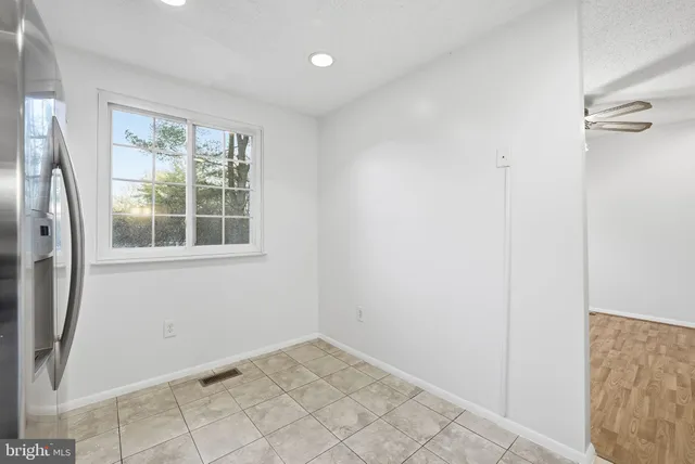 a view of empty room with windows