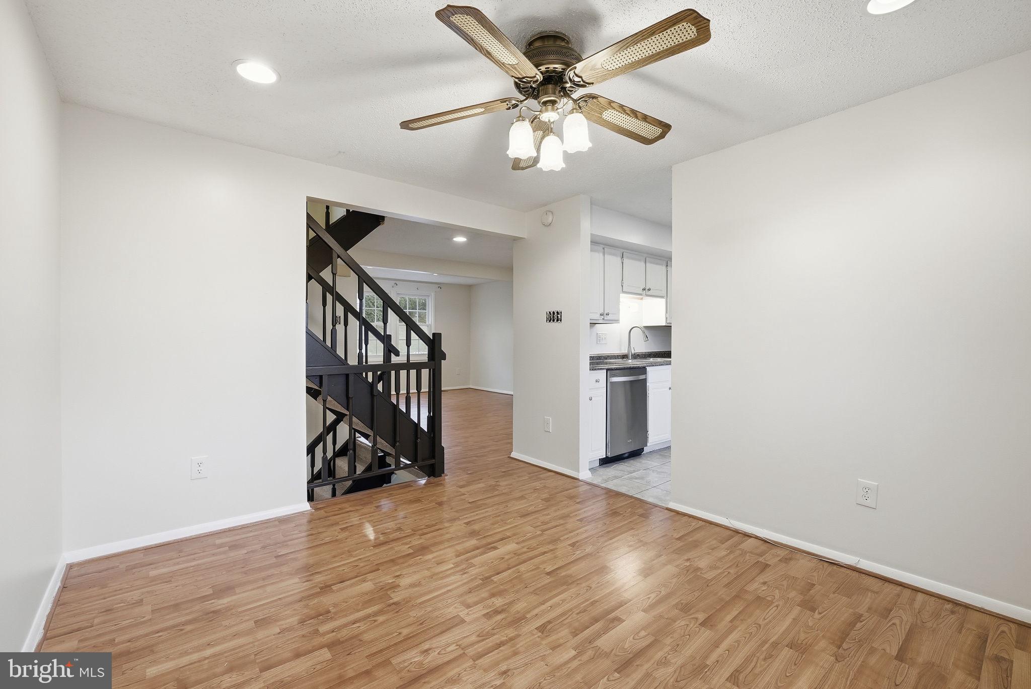9804 Gabon Court Burke, VA 22015 - Photo 10 of 30 a view of empty room with wooden floor